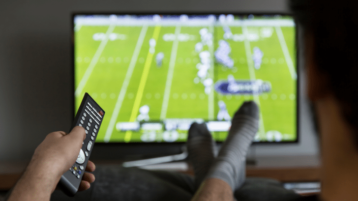 Man watching football on TV