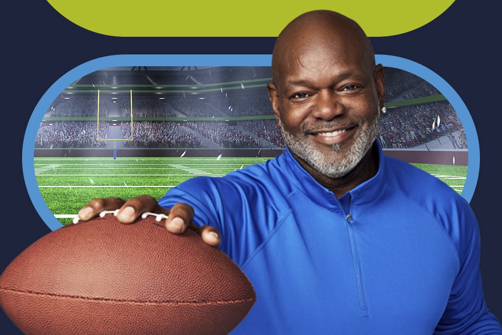 Emmitt Smith, holding football.